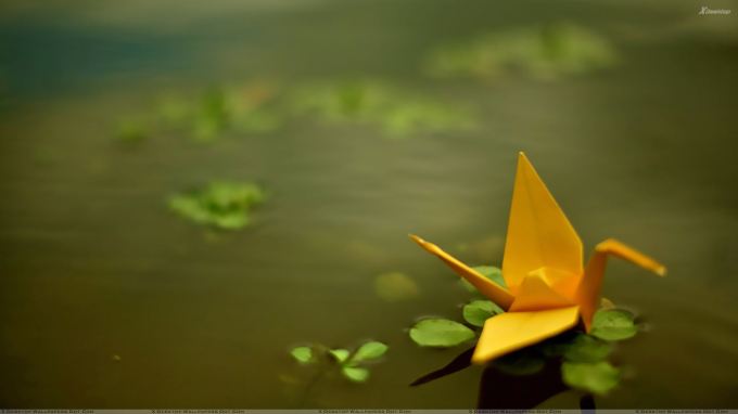 yellow-origami-boat-in-water